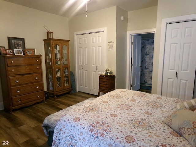 bedroom with dark wood-style flooring