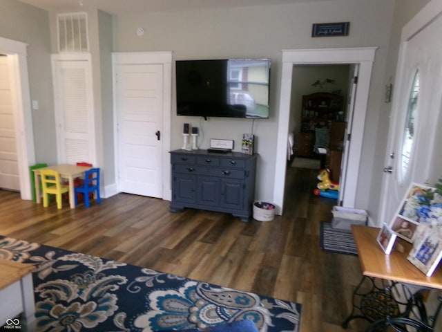 living area with dark wood finished floors