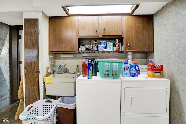 laundry room with cabinet space and washer and dryer