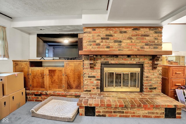 unfurnished living room featuring carpet, a brick fireplace, and a textured ceiling
