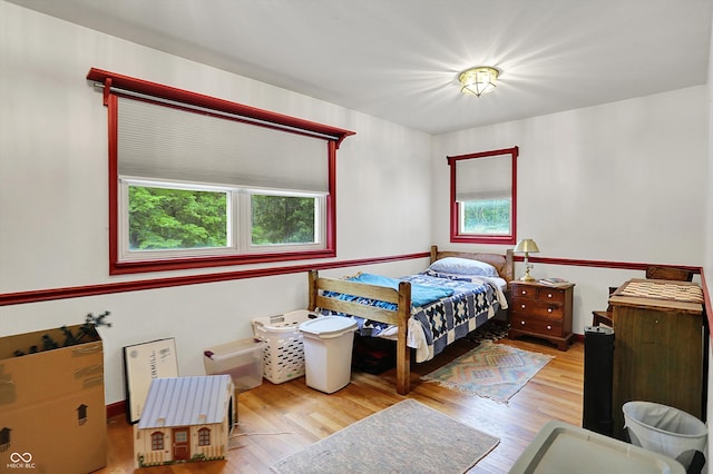 bedroom with wood finished floors