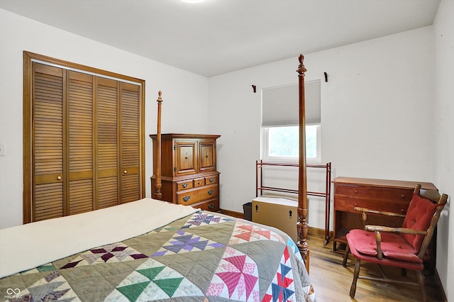 bedroom featuring wood finished floors and a closet
