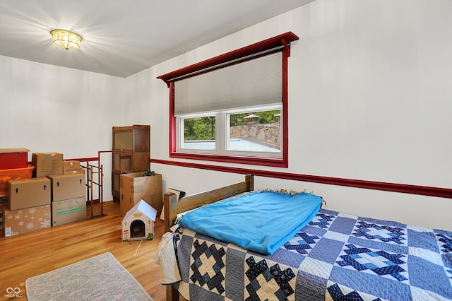 bedroom with wood finished floors