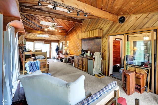 misc room with wood ceiling, carpet floors, wood walls, track lighting, and ceiling fan