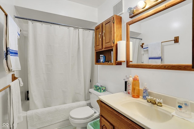 bathroom featuring shower / tub combo with curtain, toilet, and vanity