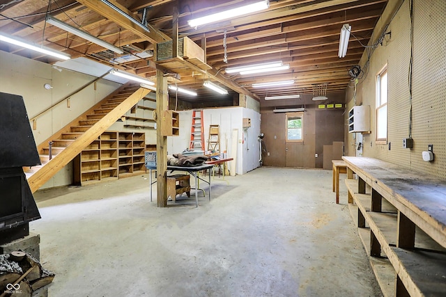 below grade area featuring a workshop area and stairway