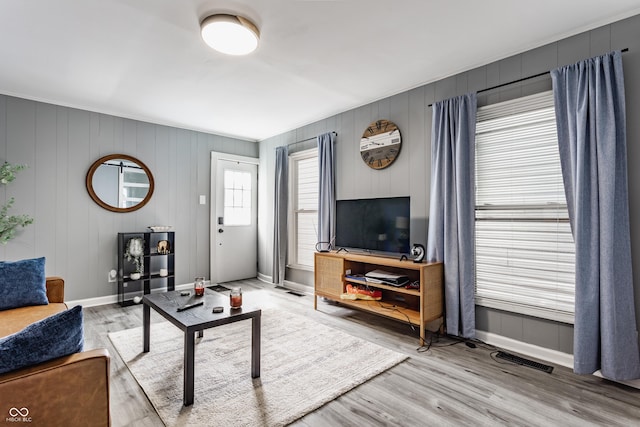 living room with wood finished floors and baseboards