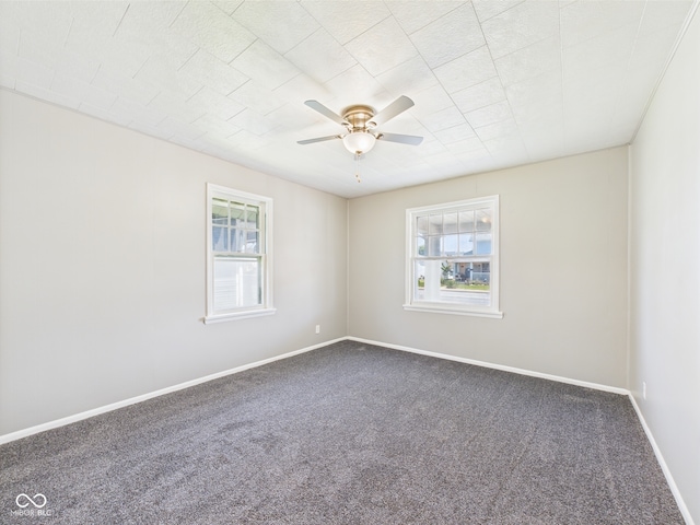 3631 Columbus Ave, Anderson, IN 46013 - carpeted spare room featuring healthy amount of natural light, a ceiling fan, and baseboards