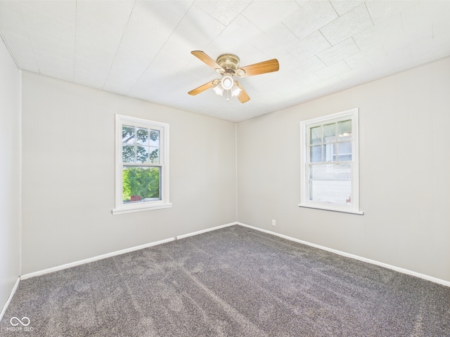 3631 Columbus Ave, Anderson, IN 46013 - empty room featuring carpet floors, a ceiling fan, and baseboards