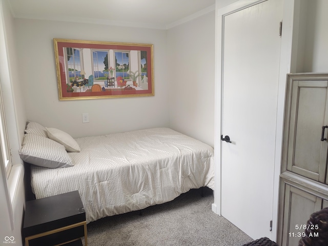 bedroom with carpet flooring and crown molding