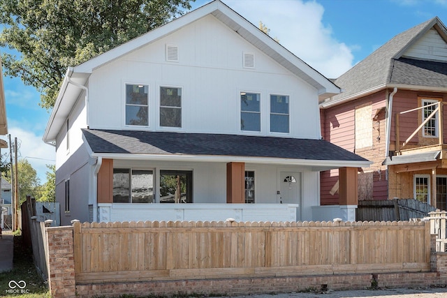 2442 Guilford Ave, Indianapolis, IN 46205 - view of front facade featuring fence and roof with shingles