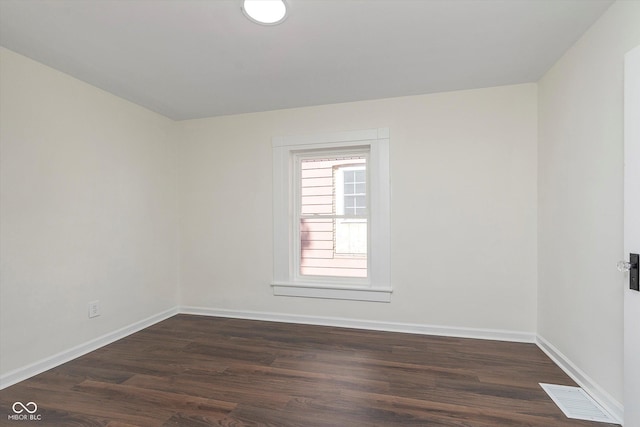 2442 Guilford Ave, Indianapolis, IN 46205 - spare room with dark wood finished floors and baseboards