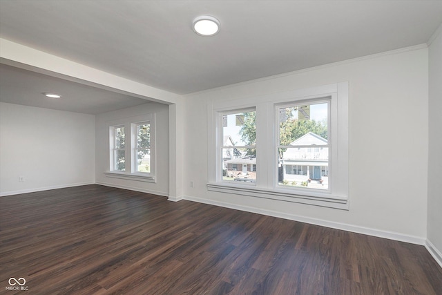 2442 Guilford Ave, Indianapolis, IN 46205 - spare room with baseboards and dark wood-style floors