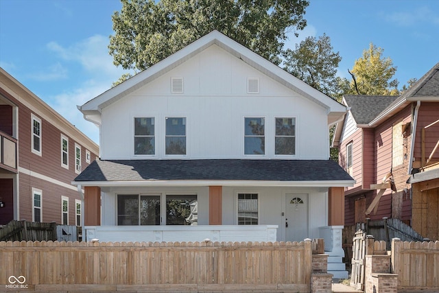 2442 Guilford Ave, Indianapolis, IN 46205 - view of front facade featuring a porch and roof with shingles