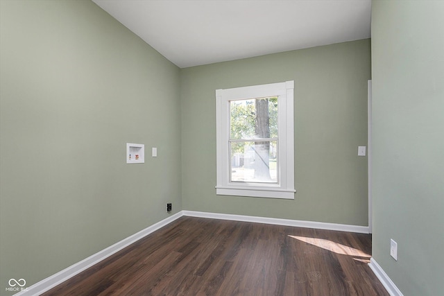 2442 Guilford Ave, Indianapolis, IN 46205 - spare room featuring dark wood-type flooring and baseboards