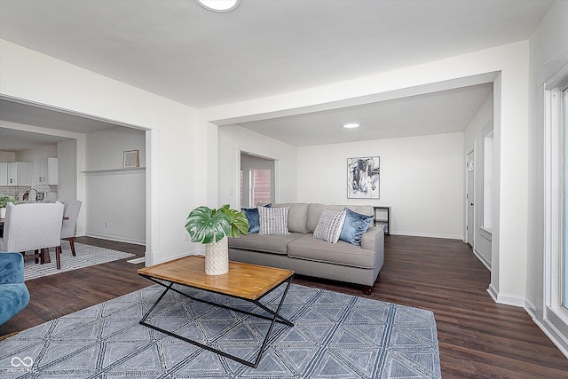 2442 Guilford Ave, Indianapolis, IN 46205 - living room with dark wood-style flooring, baseboards, and recessed lighting