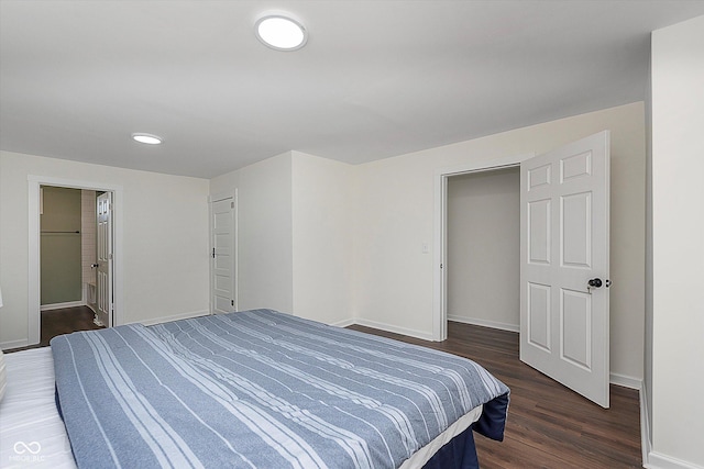 2442 Guilford Ave, Indianapolis, IN 46205 - bedroom with baseboards and dark wood-type flooring