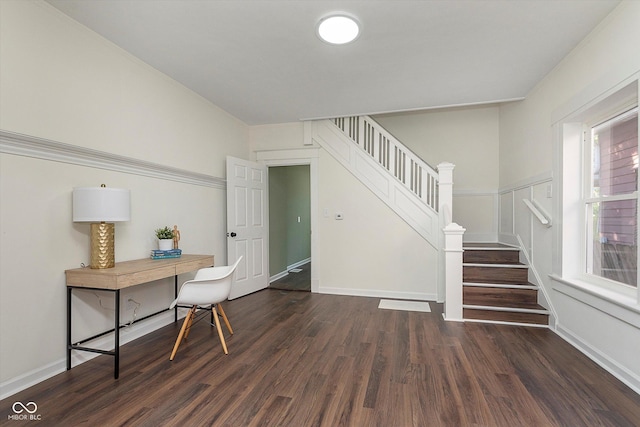 2442 Guilford Ave, Indianapolis, IN 46205 - foyer entrance with dark wood-style flooring, stairs, and baseboards