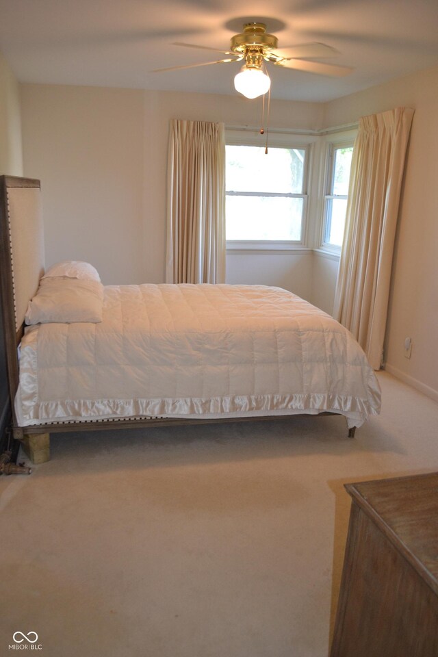 bedroom featuring carpet and a ceiling fan