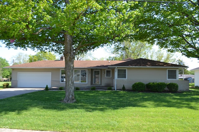 ranch-style home featuring a garage, a front lawn, concrete driveway, and a chimney