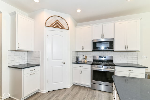89 Kinnick Dr, Greenwood, IN 46143 - kitchen featuring stainless steel appliances, light wood-type flooring, white cabinetry, and recessed lighting