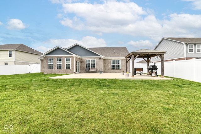 89 Kinnick Dr, Greenwood, IN 46143 - rear view of house featuring a gazebo, a patio area, and brick siding