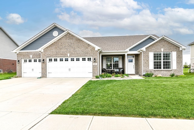 89 Kinnick Dr, Greenwood, IN 46143 - view of front of property with a garage, a front lawn, concrete driveway, and brick siding