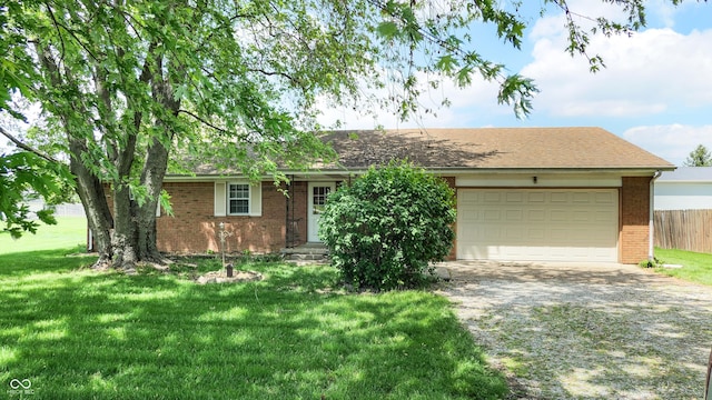 ranch-style home with brick siding, driveway, and an attached garage