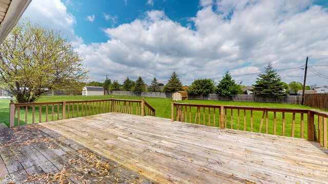deck featuring a shed and an outbuilding