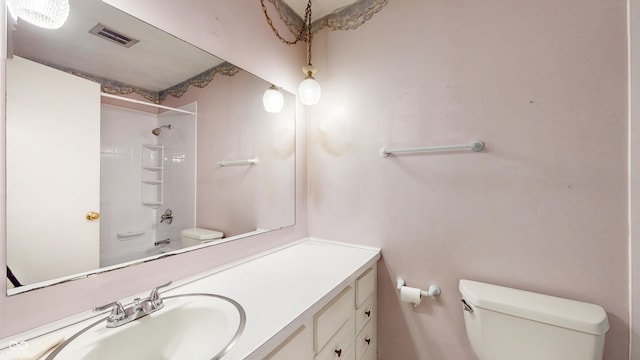 bathroom featuring toilet and vanity