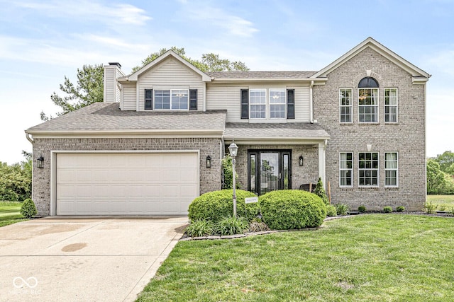 523 Torrey Ct, Avon, IN 46123 - view of front of property with brick siding, a front lawn, concrete driveway, a chimney, and an attached garage