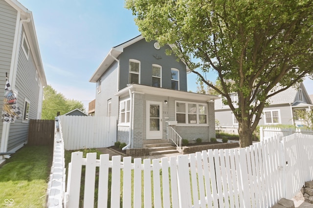 701 Lincoln St, Indianapolis, IN 46203 - traditional-style house featuring entry steps and brick siding
