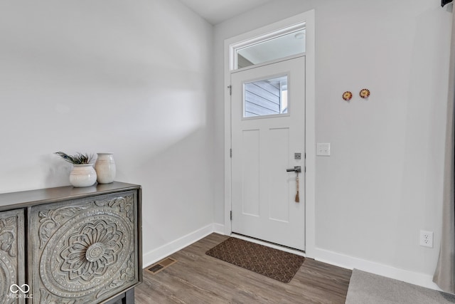 6305 Norwich Dr, Brownsburg, IN 46112 - entrance foyer with baseboards and wood finished floors