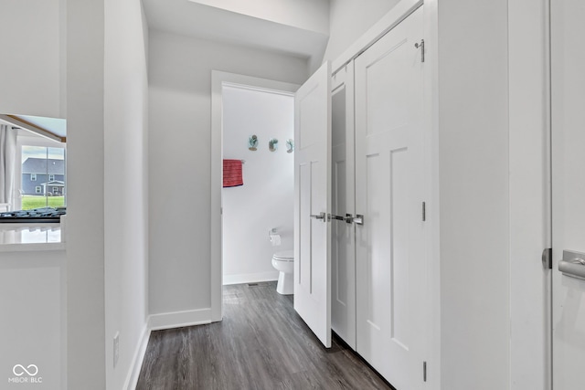 6305 Norwich Dr, Brownsburg, IN 46112 - hall featuring dark wood-style flooring and baseboards
