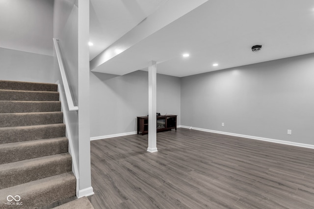 6305 Norwich Dr, Brownsburg, IN 46112 - finished basement featuring dark wood-style floors, stairway, baseboards, and recessed lighting