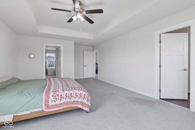 6305 Norwich Dr, Brownsburg, IN 46112 - carpeted bedroom with a raised ceiling, baseboards, and ceiling fan