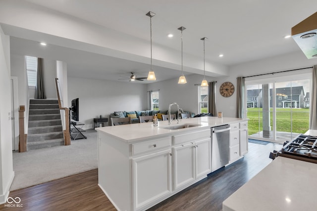 6305 Norwich Dr, Brownsburg, IN 46112 - kitchen with a sink, dishwasher, dark wood-style flooring, a kitchen island with sink, and open floor plan