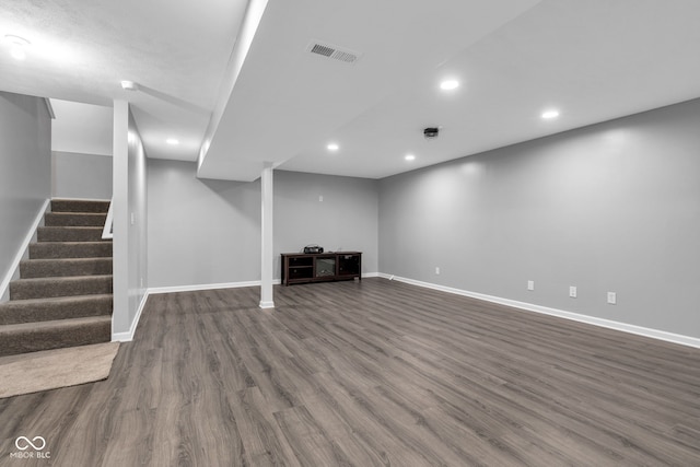 6305 Norwich Dr, Brownsburg, IN 46112 - finished basement featuring baseboards, dark wood-style floors, recessed lighting, and stairway