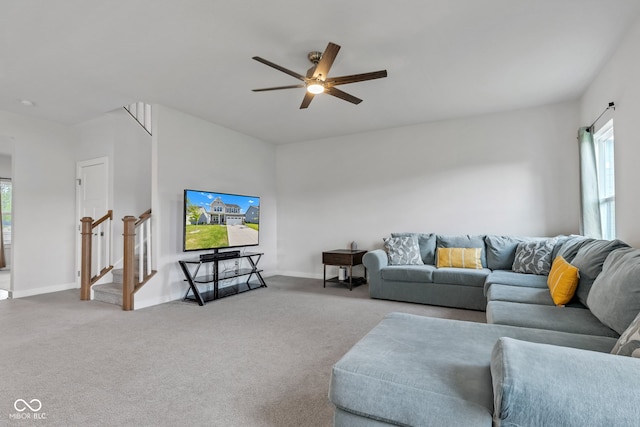6305 Norwich Dr, Brownsburg, IN 46112 - carpeted living area with ceiling fan, baseboards, and stairway