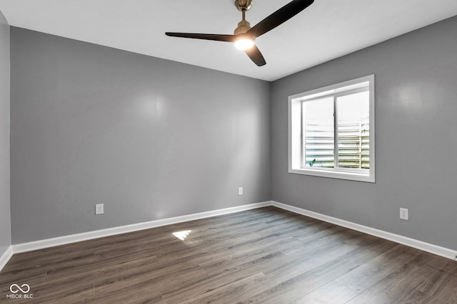 6305 Norwich Dr, Brownsburg, IN 46112 - unfurnished room featuring dark wood-style flooring, a ceiling fan, and baseboards