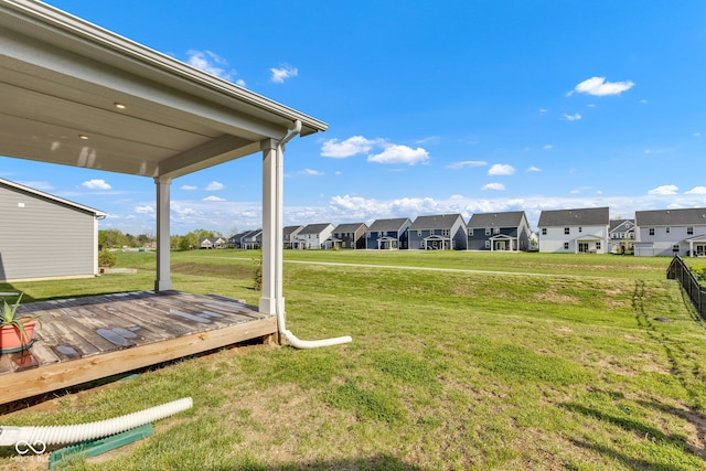 6305 Norwich Dr, Brownsburg, IN 46112 - view of grassy yard with a residential view and a wooden deck