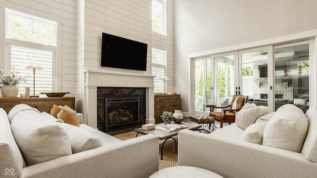 6734 W Stonegate Dr, Zionsville, IN 46077 - living area featuring a towering ceiling and a high end fireplace