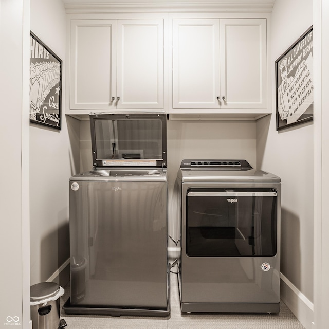 6734 W Stonegate Dr, Zionsville, IN 46077 - clothes washing area with separate washer and dryer, cabinet space, and baseboards