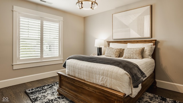 6734 W Stonegate Dr, Zionsville, IN 46077 - bedroom with baseboards and wood finished floors