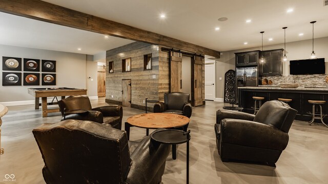6734 W Stonegate Dr, Zionsville, IN 46077 - living room featuring a barn door, recessed lighting, baseboards, beam ceiling, and finished concrete floors