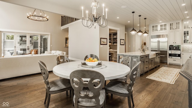 6734 W Stonegate Dr, Zionsville, IN 46077 - dining area with a chandelier, recessed lighting, dark wood-style flooring, and wood ceiling