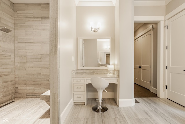 6734 W Stonegate Dr, Zionsville, IN 46077 - bathroom featuring wood finished floors, tiled shower, and baseboards