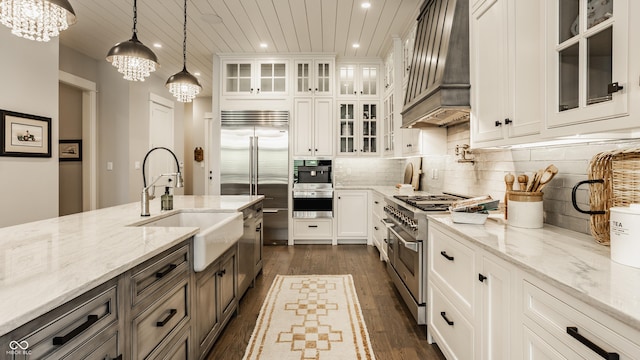 6734 W Stonegate Dr, Zionsville, IN 46077 - kitchen featuring custom range hood, premium appliances, a sink, recessed lighting, and a chandelier