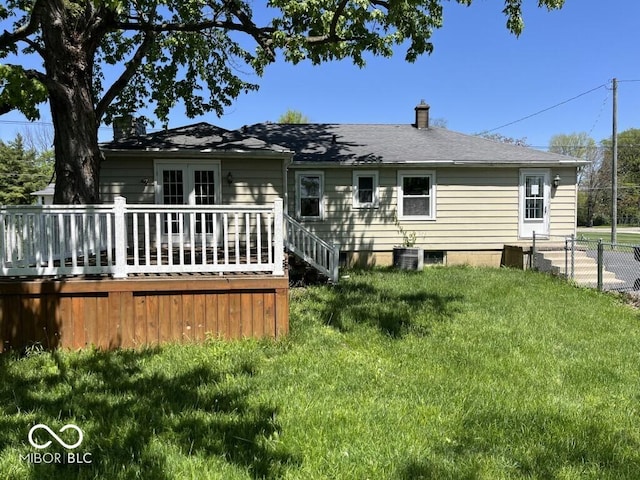 3209 Mounds Rd, Anderson, IN 46016 - back of property featuring a wooden deck, a chimney, central AC unit, and french doors