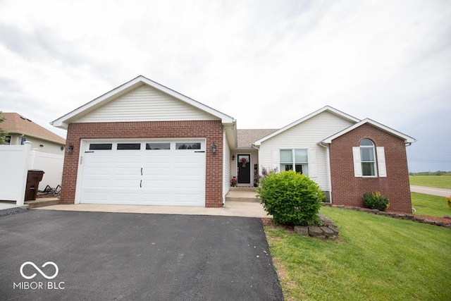 ranch-style house with brick siding, asphalt driveway, and an attached garage